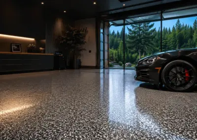 Black sports car parked on a glossy flake-coated garage floor