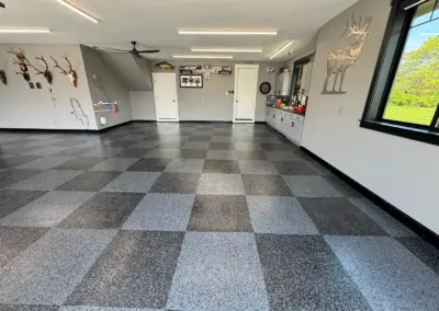 Garage floor with a gray and white checkerboard flake coating