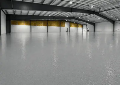Large warehouse with a glossy gray epoxy floor