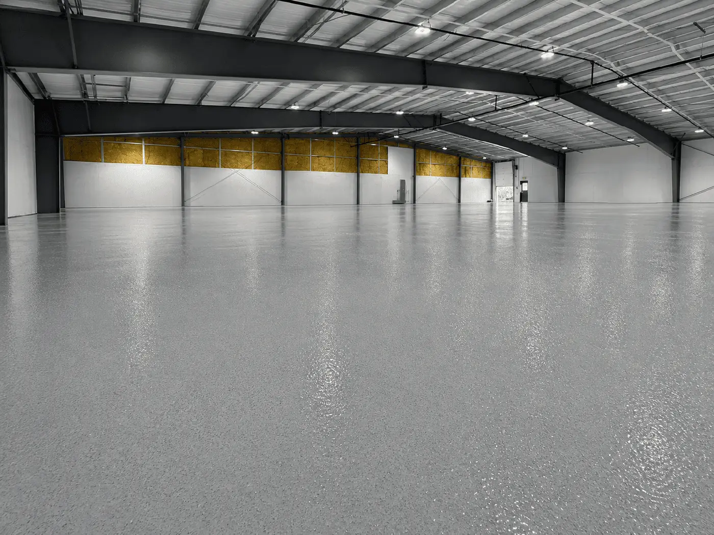 Large warehouse with a glossy gray epoxy floor