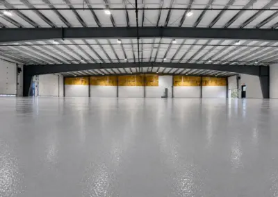 Large warehouse with a glossy gray epoxy floor