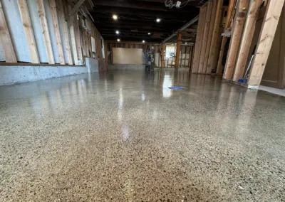 Exposed aggregate floor coating in a commercial space with wood walls