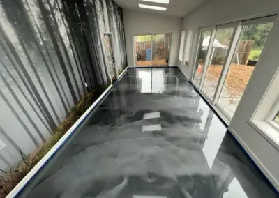 Sunroom with a silver and black metallic epoxy floor