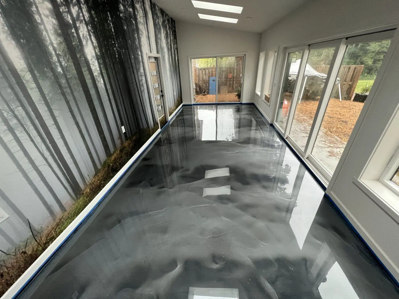 Sunroom with a silver and black metallic epoxy floor